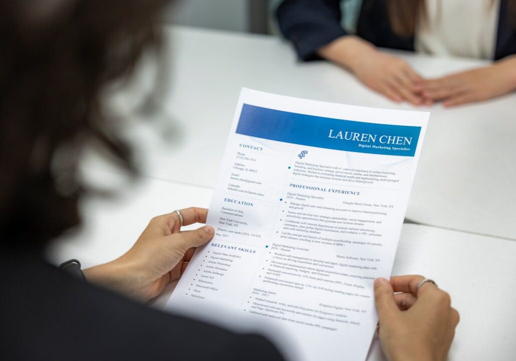 Person reviewing a professional resume titled Lauren Chen.